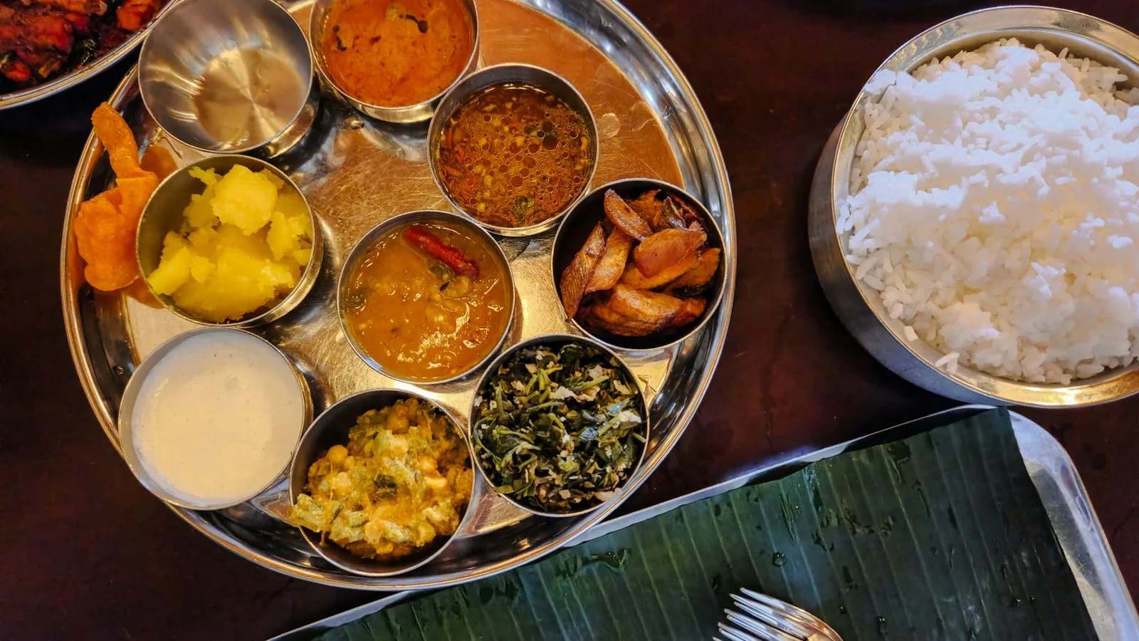 An Indian thali with rice and a selection of curries and vegetable dishes. Illustrative photo.